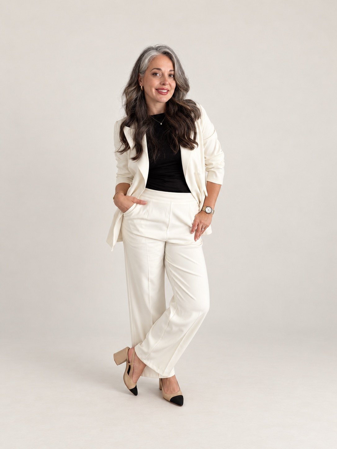 Dina Besirevic, founder of ELARIS North Shore, in a white suit
